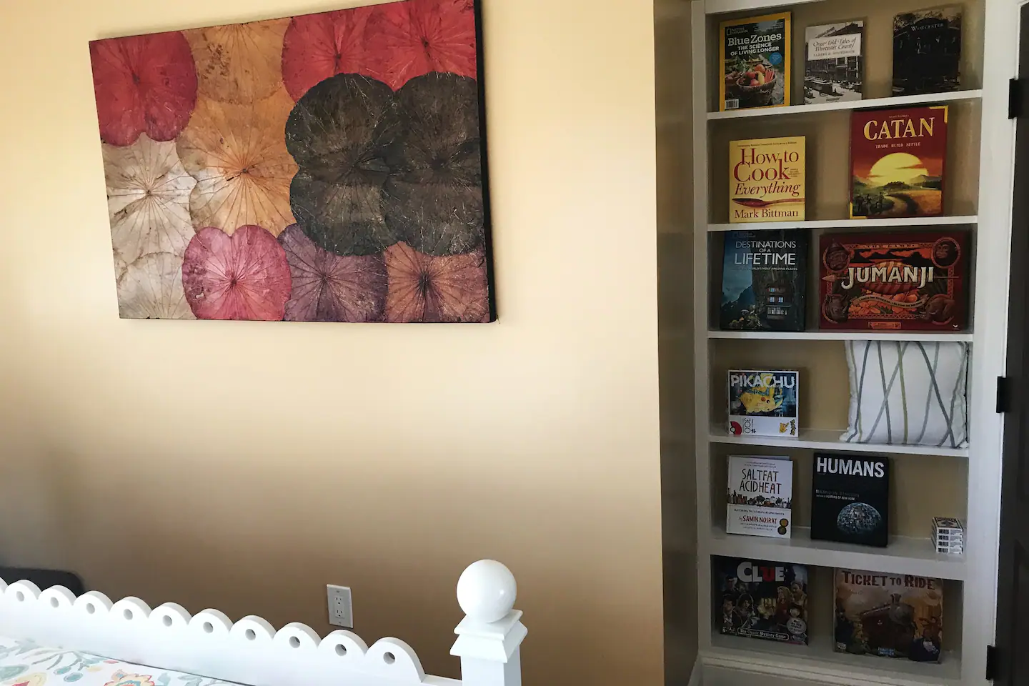 Enjoy books and games from the Summer bedroom’s bookcase.