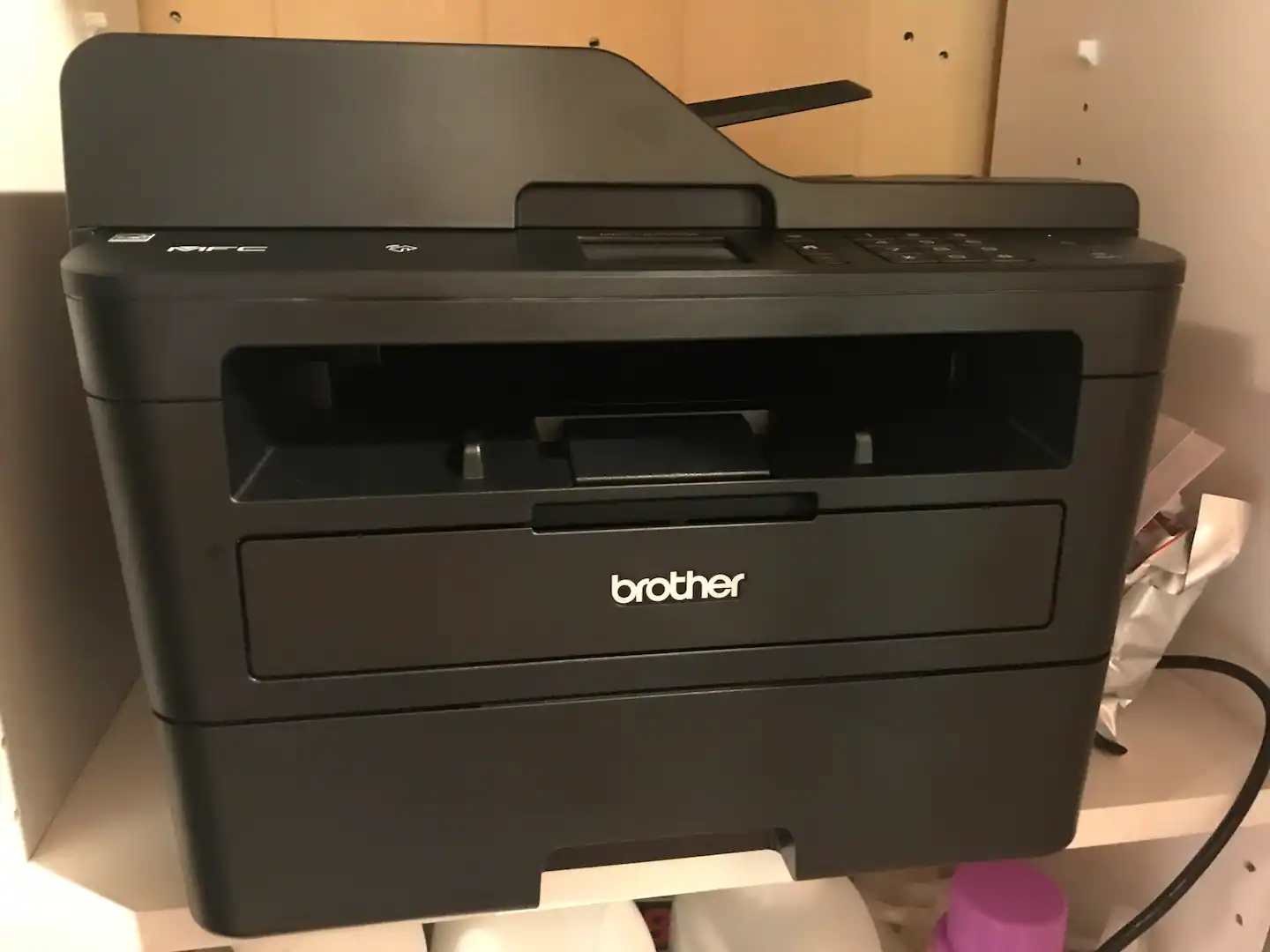 Brother Model MFC-L27500DWXL; Laser All-in-One Multi-function Printer; "Save time/money w/duplex (2-sided) printing & single-pass duplex copying; scanning via 50-sheet automatic document feeder and multi-page copy/scan." Central access in hall.